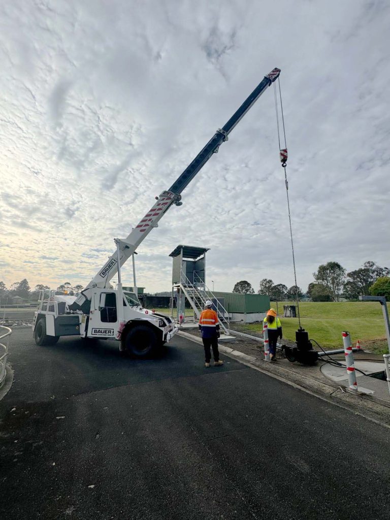 team operating a large crane outdoors. northern rivers nsw